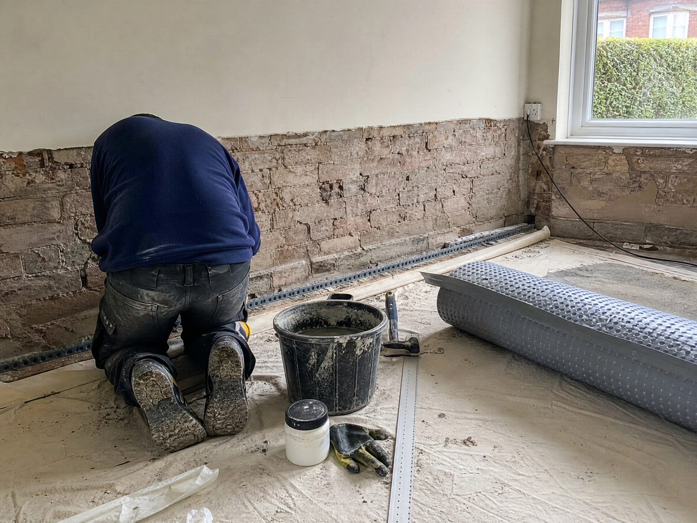 Overview of damp proofing work in progress at a British residential property